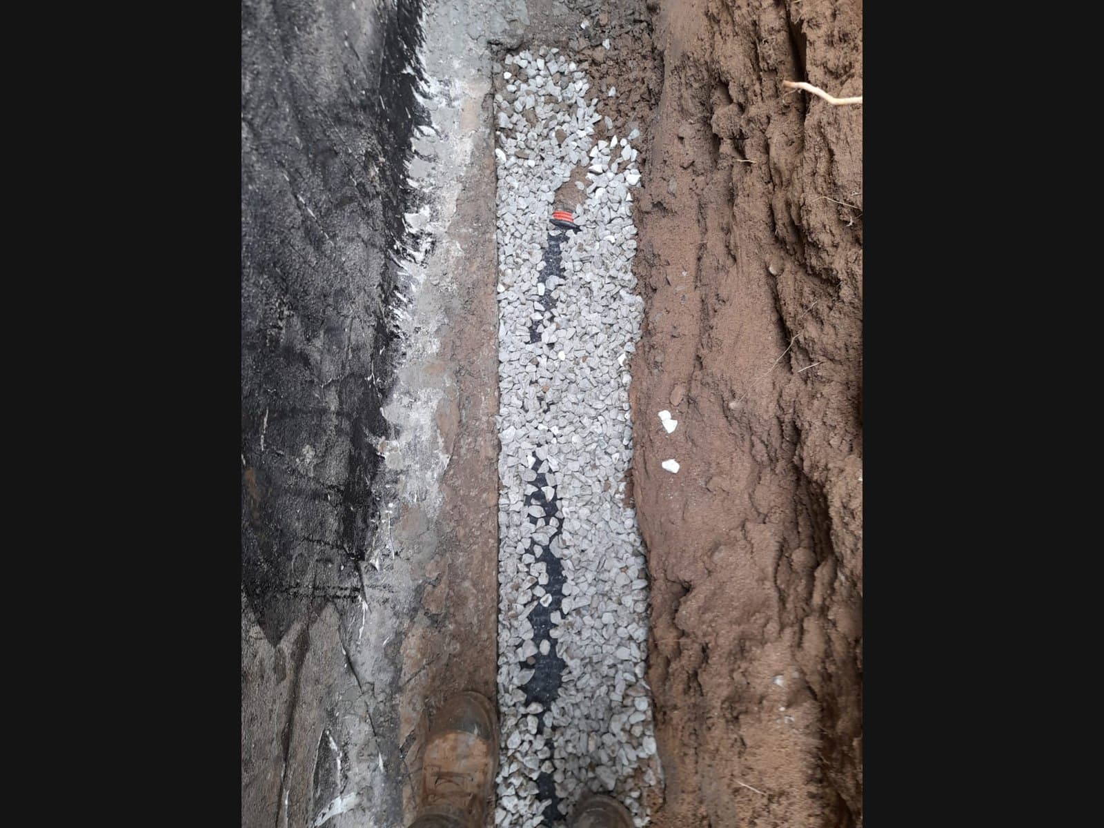 Standing water in a drainage pipe — a late-stage Muskoka waterproofing problem