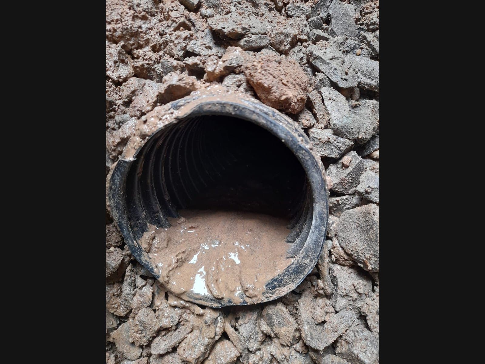 Exterior waterproofing trench that drives per-linear-foot cost in Muskoka