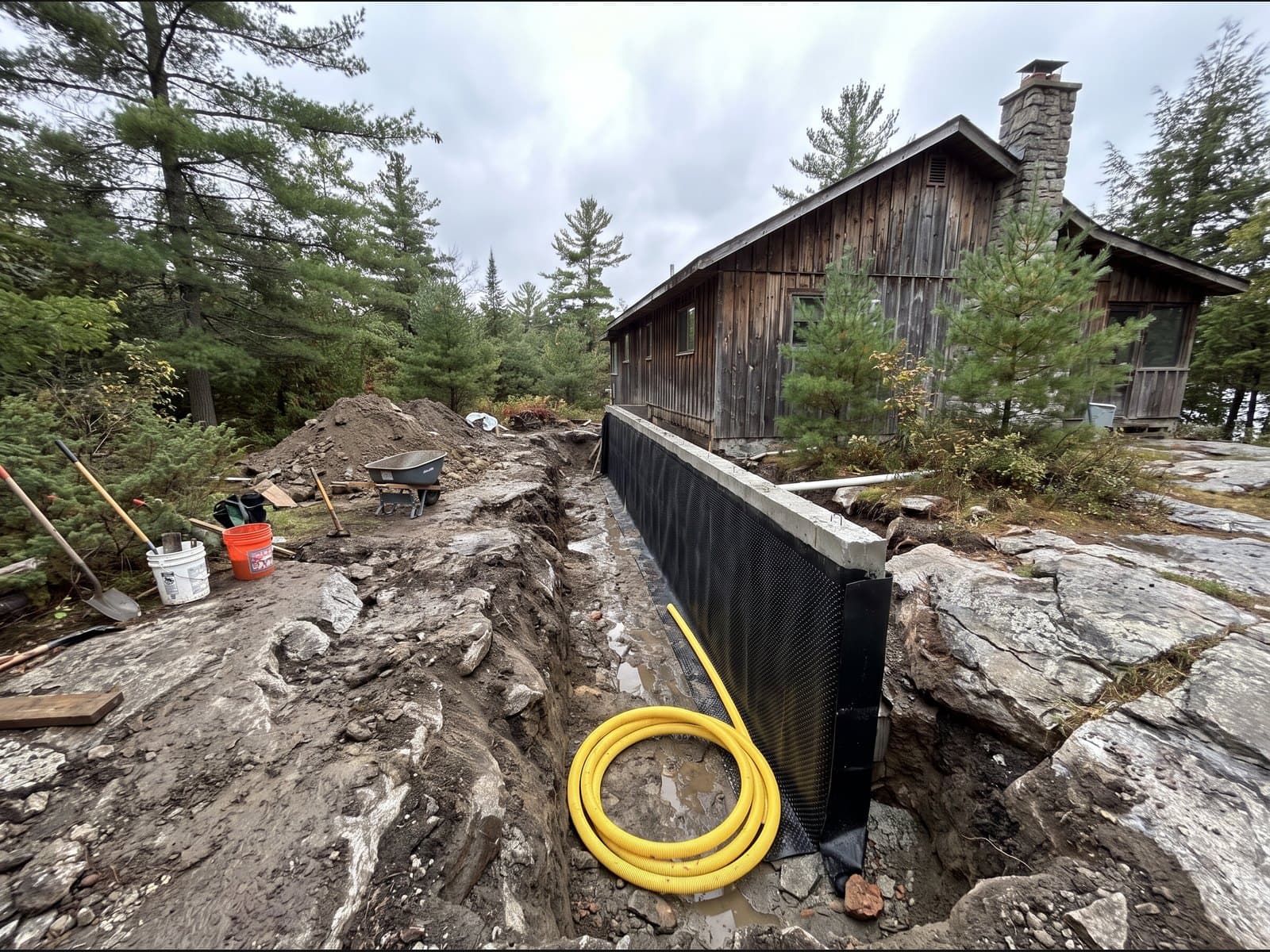 Exterior basement waterproofing excavation in Muskoka